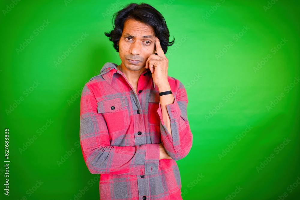 Thoughtful man in red plaid shirt Thoughtful man in red plaid shirt