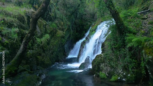 Amazon Jungle With Falls Over Moss-Covered Boulders On Santa Leocadia Waterfall In Mazaricos, Galicia Spain. Pullback Shot photo