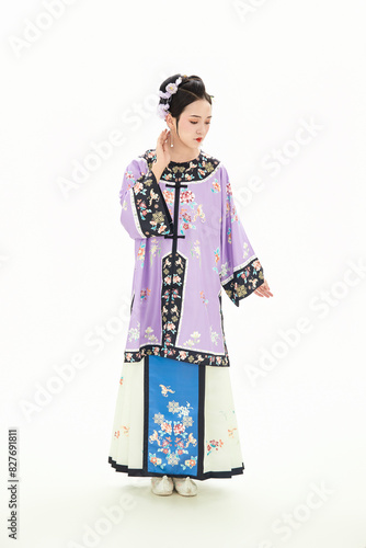 A woman wearing ancient Chinese clothing against a white background.