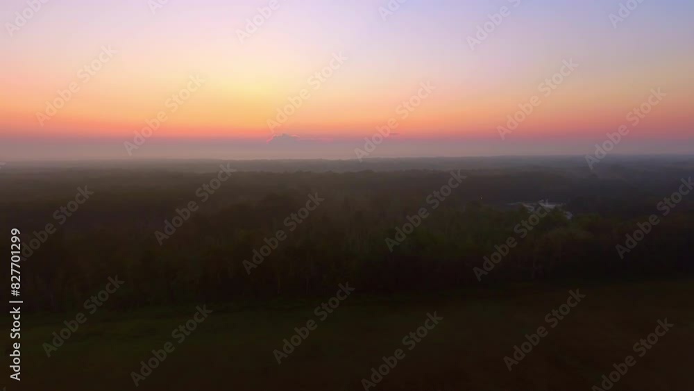 Aerial Scenic Shot Of Trees On Tranquil Landscape Against Orange Cloudy Sky, Drone Flying Forward During Foggy Weather At Sunset - Bayou Vista, Texas Aerial Scenic Shot Of Trees On Tranquil Landscape Against Orange Cloudy Sky, Drone Flying Forward During Foggy Weather At Sunset - Bayou Vista, Texas