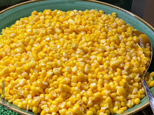 Close up view of a bowl of sweetcorn on the buffet of a restaurant