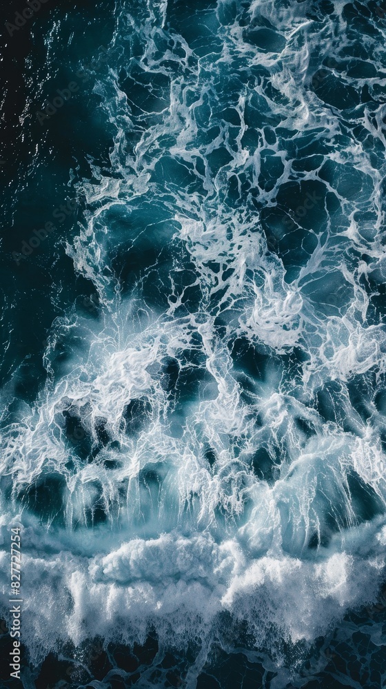 Fototapeta premium Riding the Wave: Surfer's Board Cutting Through Deep Blue Pacific Ocean Waters
