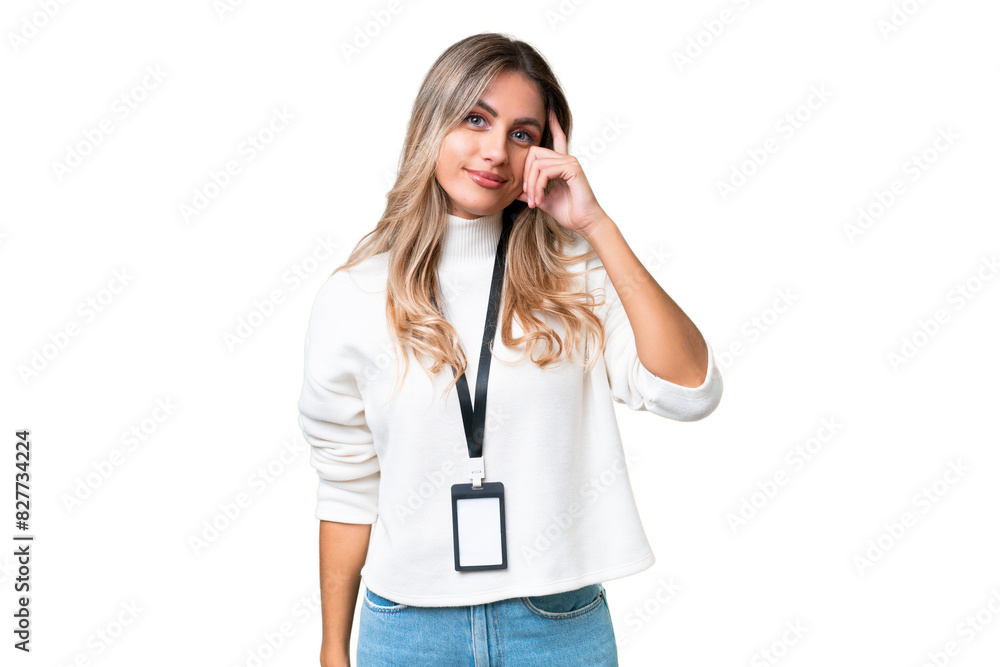 Young Uruguayan woman with ID card over isolated background thinking an idea Young Uruguayan woman with ID card over isolated background thinking an idea