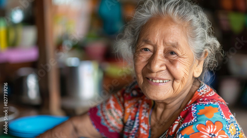 Portrait of a joyful elderly woman in colorful attire, exuding warmth and happiness