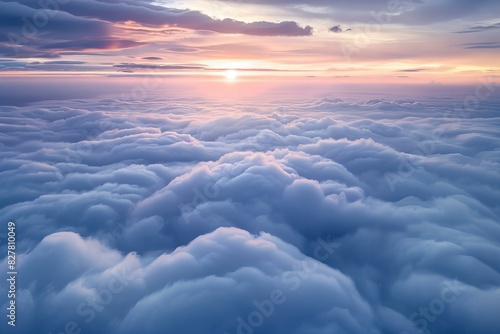 Photograph of an endless sea of clouds, seen from above in soft colors photo