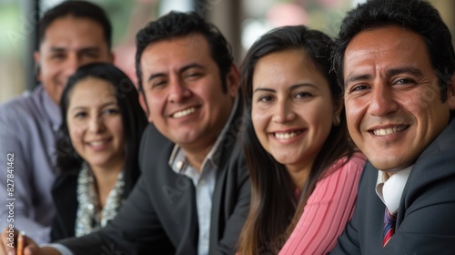 A group of diverse business professionals smiling and looking at the camera. AIG535