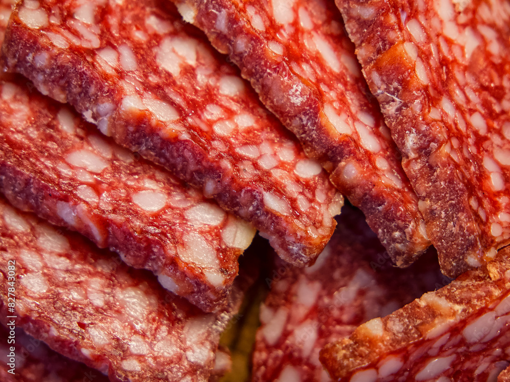 Cured Meat Detail. A detailed view of marbled salami slices, suitable for culinary advertising. Cured Meat Detail. A detailed view of marbled salami slices, suitable for culinary advertising.