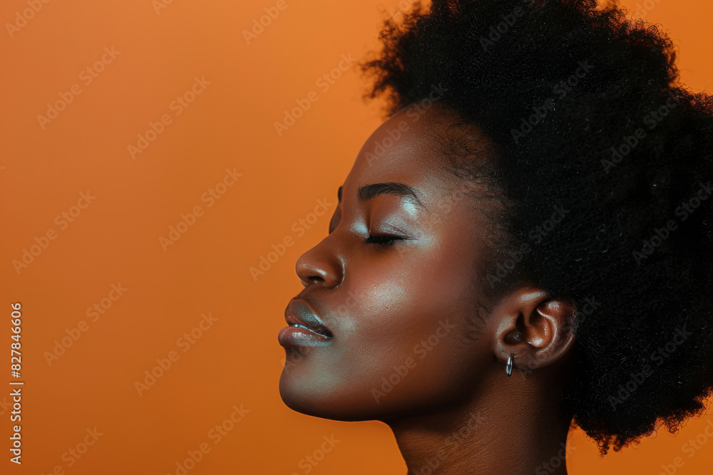 A close up of a black woman's face with her eyes closed looking to a side A close up of a black woman's face with her eyes closed looking to a side