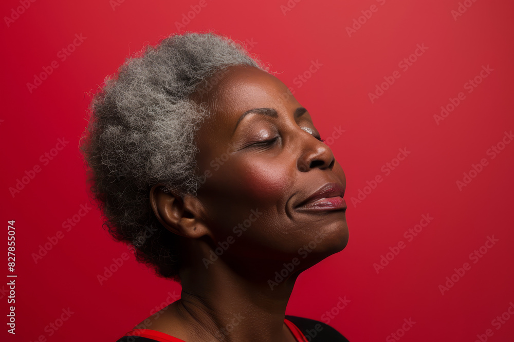 A close up of a black woman's face with her eyes closed looking to a side A close up of a black woman's face with her eyes closed looking to a side