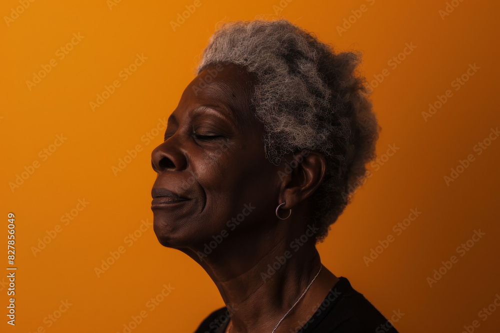 A close up of a black woman's face with her eyes closed looking to a side A close up of a black woman's face with her eyes closed looking to a side