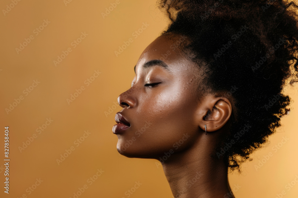 A close up of a black woman's face with her eyes closed looking to a side A close up of a black woman's face with her eyes closed looking to a side