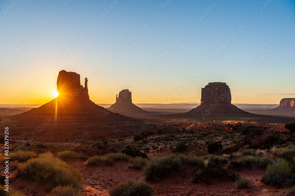 Early morning sunrise over the famous merrick en mittens butte at monument valley, Az.