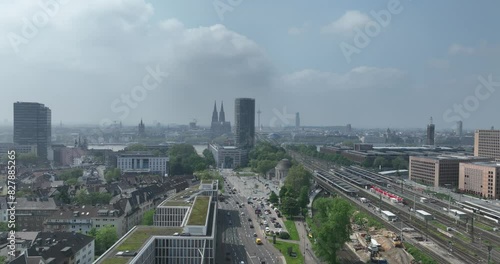 Aerial rising view on the skyline of Cologne, cologne cathedral, rhine river, colonius tv tower, severinbrucke bridge, rail way station, roads and infrastructure. photo