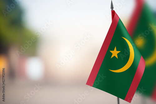 Small flags of Mauritania on a blurred background