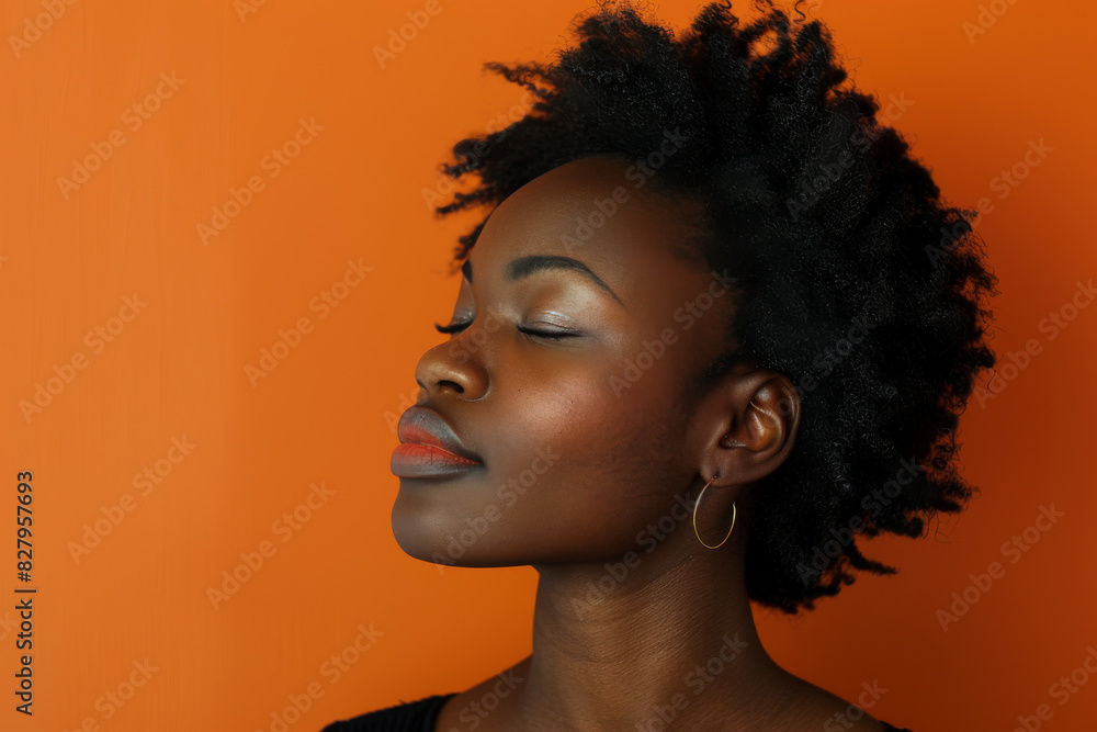 A close up of a black woman's face with her eyes closed looking to a side A close up of a black woman's face with her eyes closed looking to a side