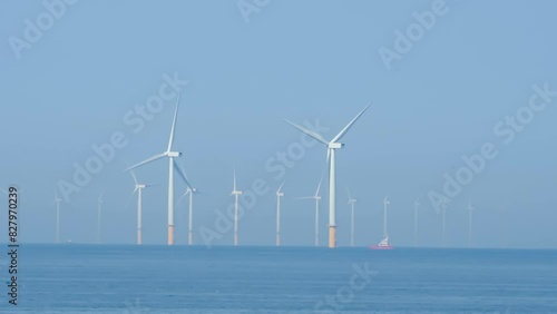 Gwynt y Môr (Sea wind) offshore wind farm with 150m high turbines in action photo