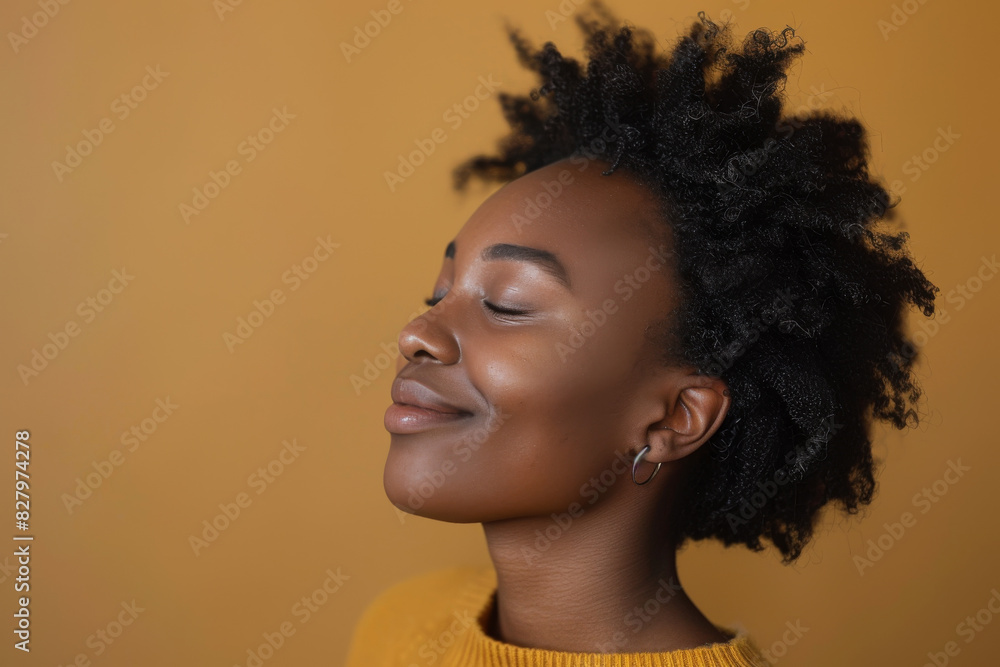 A close up of a black woman's face with her eyes closed looking to a side A close up of a black woman's face with her eyes closed looking to a side