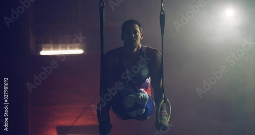 Handsome Muscular Athletic Man In Gymnastics Uniform Doing Intense Workout On Gymnastic Rings Sports Center Healthy Lifestyle Effort Gymnastics Competitive Mindset Concept 4k photo