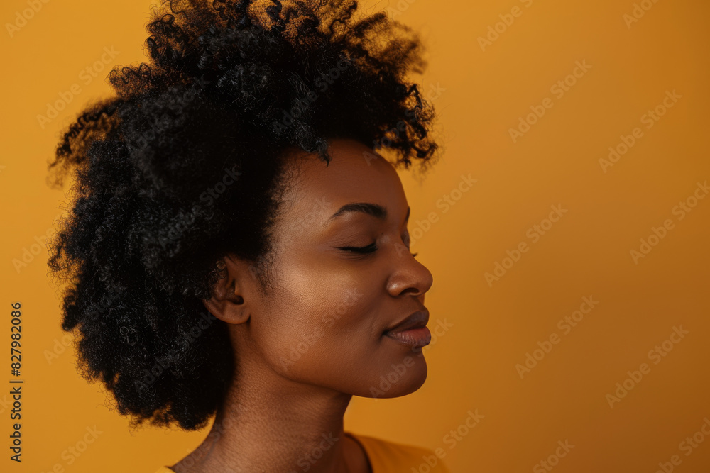 A close up of a black woman's face with her eyes closed looking to a side A close up of a black woman's face with her eyes closed looking to a side
