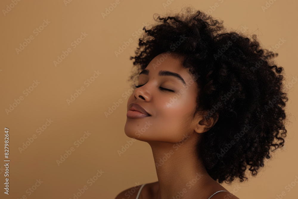 A close up of a black woman's face with her eyes closed looking to a side A close up of a black woman's face with her eyes closed looking to a side