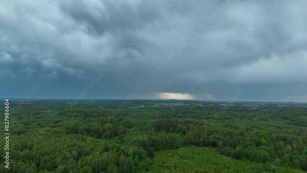 Aerial View of Countryside Landscape with Storm Clouds and Rain Showers Over Green Fields and River, Alanta, Lithuania. Aerial View of Countryside Landscape with Storm Clouds and Rain Showers Over Green Fields and River, Alanta, Lithuania.