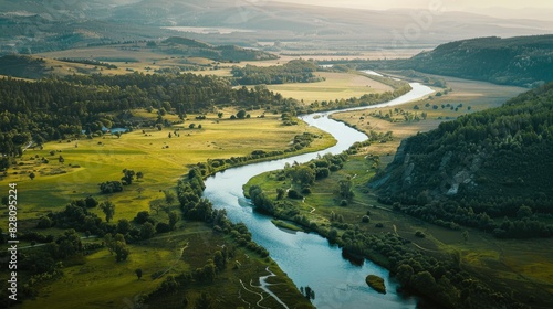 High-angle shot of a winding river cutting through a picturesque landscape.