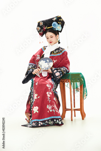 A woman wearing ancient Chinese clothing against a white background.