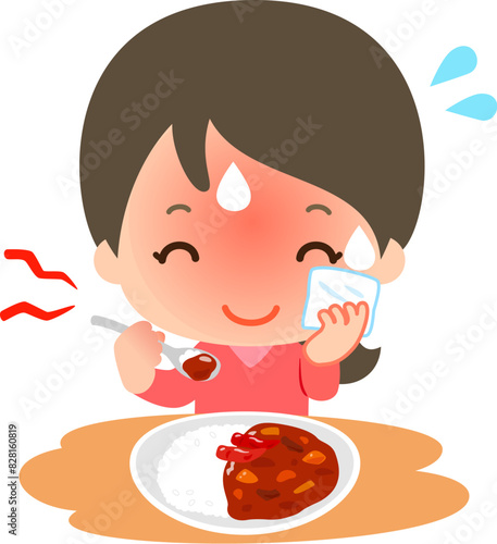 汗をかきながら辛いカレーを食べる笑顔の女性