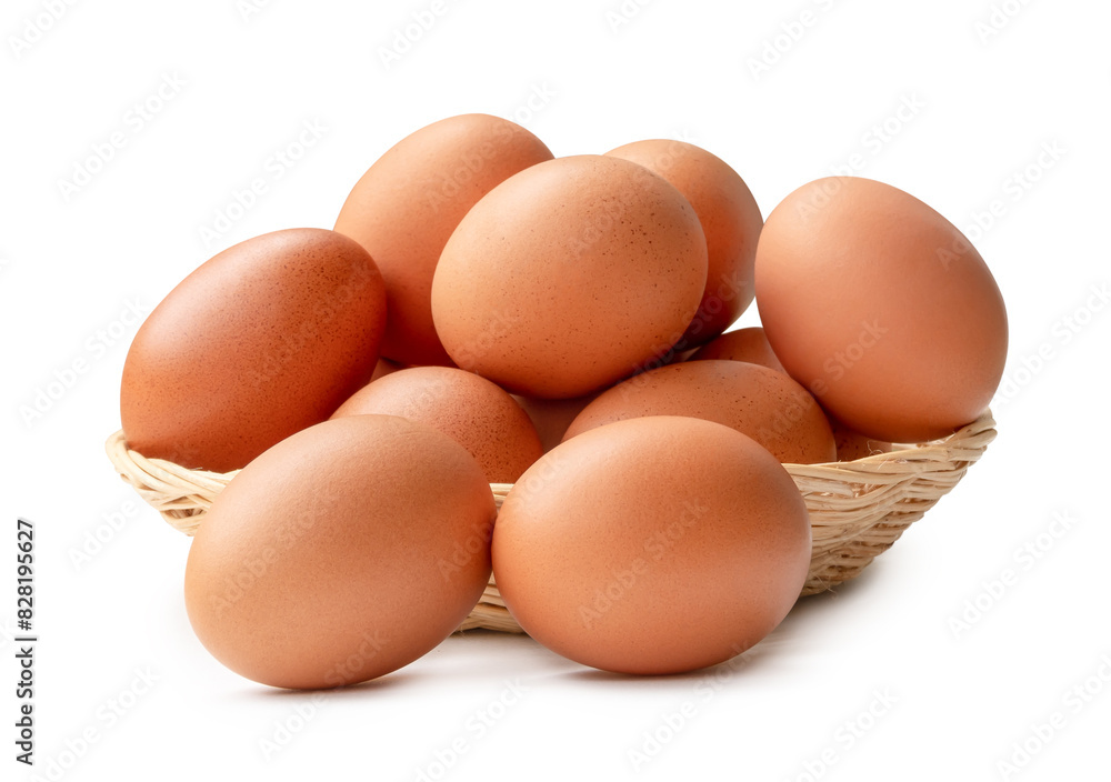 Side view of brown chicken eggs in stack in wicker basket isolated on white background Side view of brown chicken eggs in stack in wicker basket isolated on white background