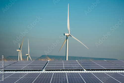 Obraz na płótnie Solar cells and wind turbines produce electricity, clean energy. w salonie
