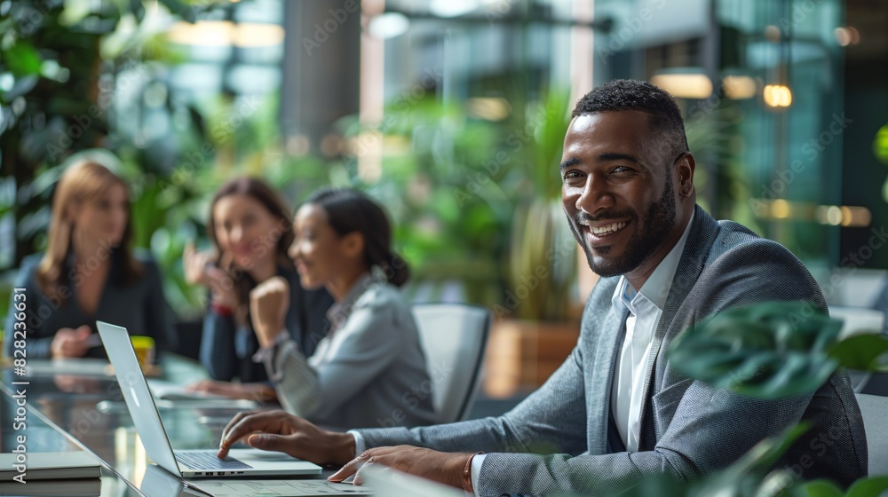 A corporate office with business people working on laptops and tablets, focusing on strategic growth and development A corporate office with business people working on laptops and tablets, focusing on strategic growth and development