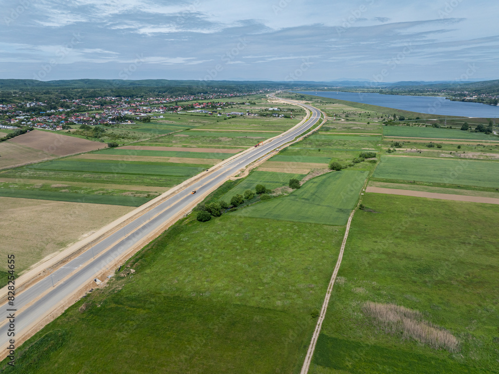 Highways under construction of Romania. Aerial view of A1 Bucuresti Pitesti Curtea de Arges Sibiu highway during construction. High speed roads infrastructure industry. Highways under construction of Romania. Aerial view of A1 Bucuresti Pitesti Curtea de Arges Sibiu highway during construction. High speed roads infrastructure industry.