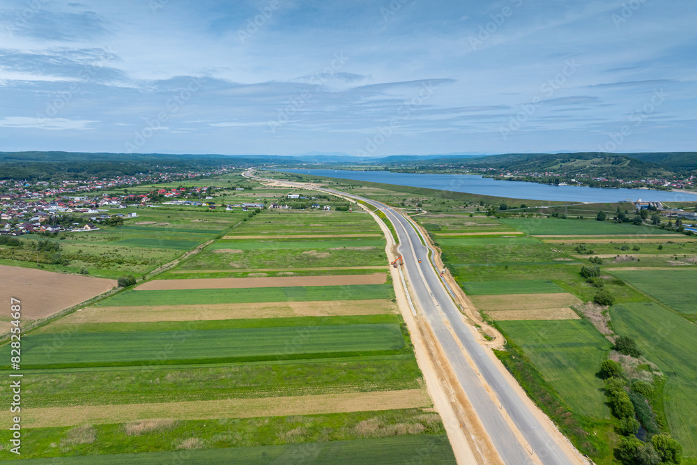 Highways under construction of Romania. Aerial view of A1 Bucuresti Pitesti Curtea de Arges Sibiu highway during construction. High speed roads infrastructure industry. Highways under construction of Romania. Aerial view of A1 Bucuresti Pitesti Curtea de Arges Sibiu highway during construction. High speed roads infrastructure industry.
