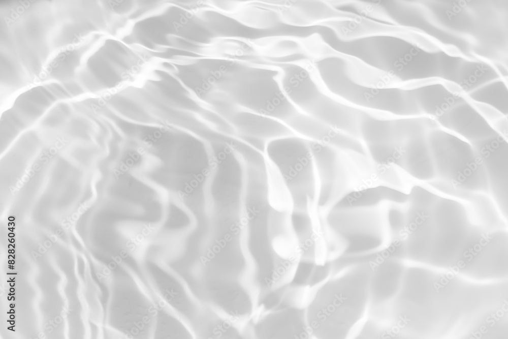 White water with ripples on the surface. Defocus blurred transparent white colored clear calm water surface texture with splashes and bubbles. Water waves with shining pattern texture background. White water with ripples on the surface. Defocus blurred transparent white colored clear calm water surface texture with splashes and bubbles. Water waves with shining pattern texture background.