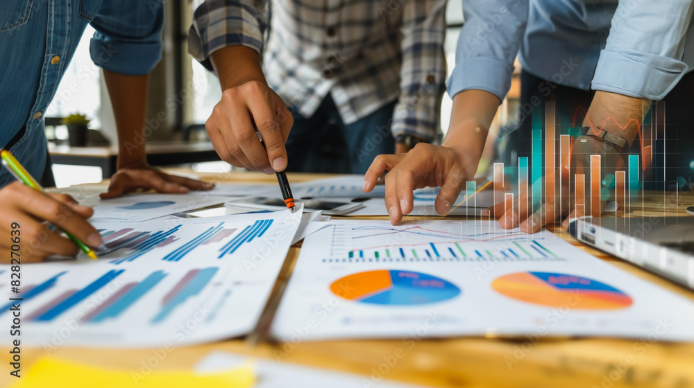 Fototapeta premium Professional business team working on a project together in the office Using economic growth charts and network connections to accompany the data. in analyzing future trends