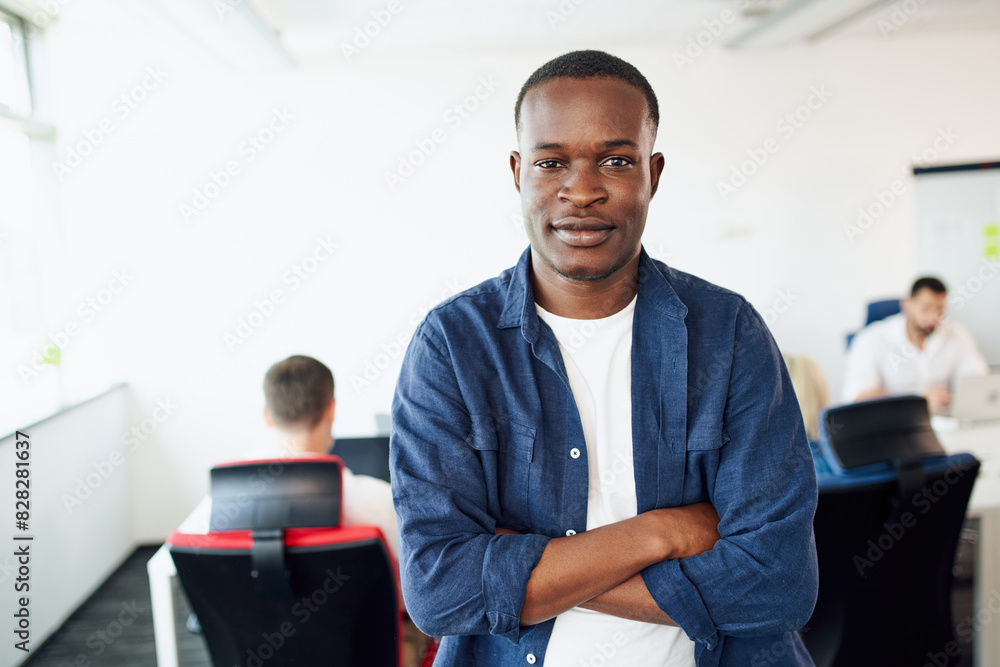 Portrait of casual young African man at modern office Portrait of casual young African man at modern office