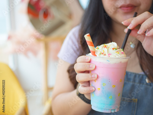 Close-up shot of a cold sweet glass In the hands of chubby woman
