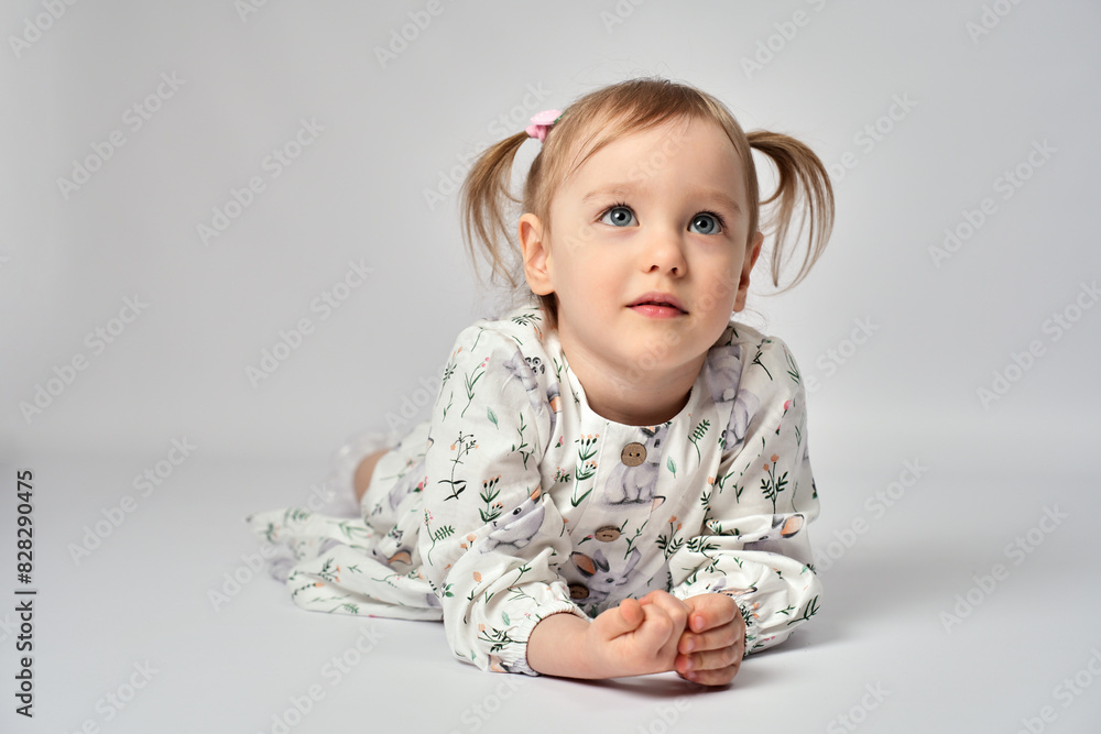 Portrait of cute little girl with blue eyes on a white background with copy space Portrait of cute little girl with blue eyes on a white background with copy space