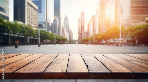 A wooden table top with blur background of street in downtown business district with people walking.