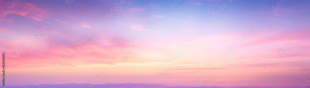 Fototapeta premium Beautiful pastel sunset sky with soft clouds in shades of pink, purple, and blue, creating a serene and calming landscape.