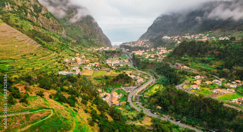 Fototapeta premium Rainy day with aerial view of Capelinha de Nossa Senhora de Fatima, Sao Vicente, Madeira Island, Portugal