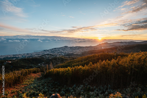 beautiful sunset over the city of Funchal on Madeira from the location Miradouro do Pico Alto. Mountains landscape photo