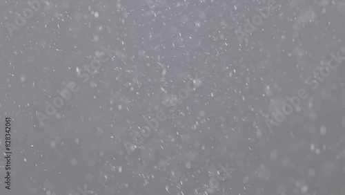 White snowflakes on a neutral swirl on a neutral background photo