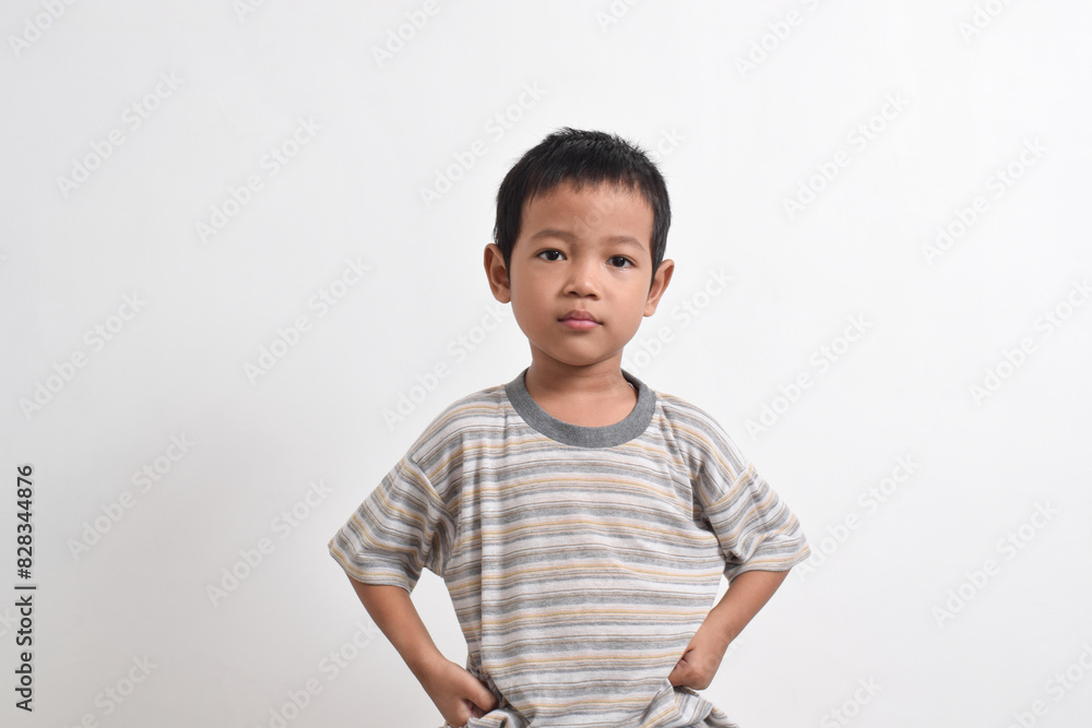 Image of Asian child posing angry face on white background. portrait of an Asian boy Image of Asian child posing angry face on white background. portrait of an Asian boy