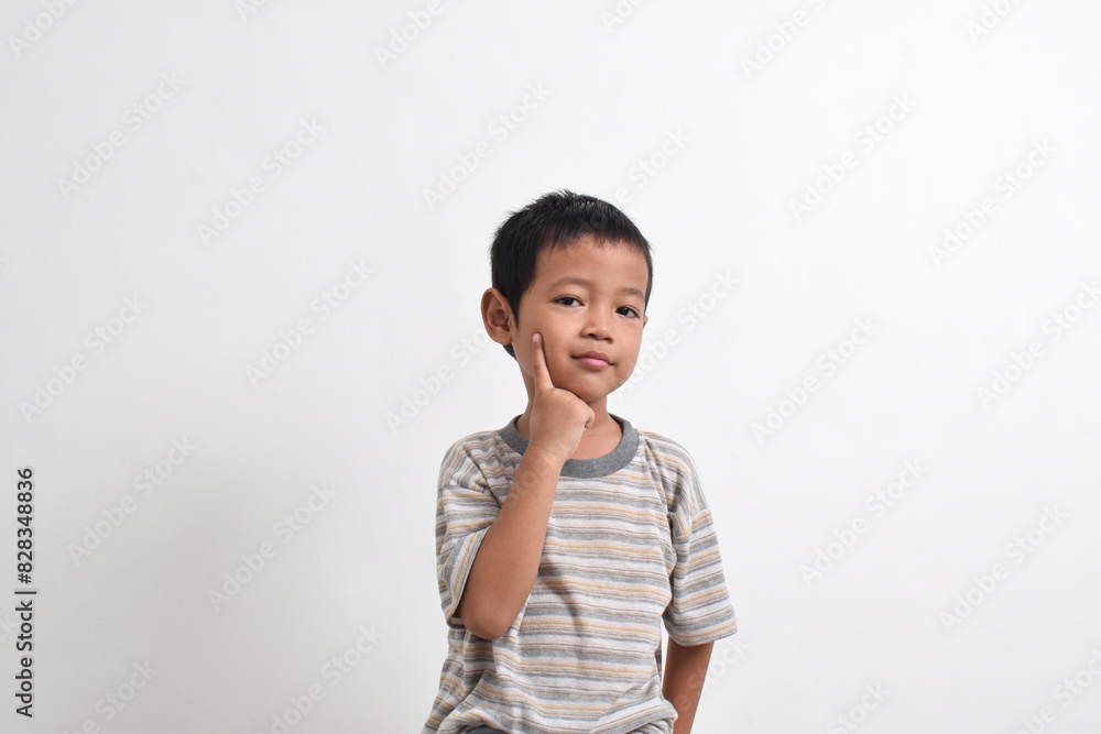 Image of Asian child posing cutely on white background. portrait of an Asian boy Image of Asian child posing cutely on white background. portrait of an Asian boy
