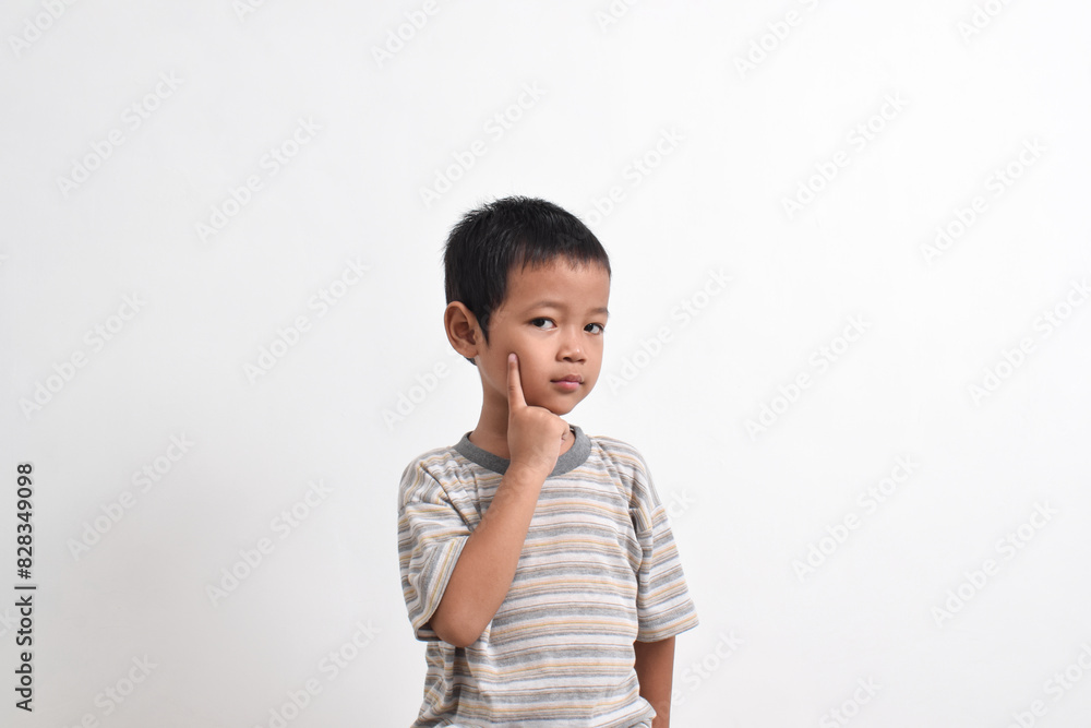 Image of Asian child posing cutely on white background. portrait of an Asian boy Image of Asian child posing cutely on white background. portrait of an Asian boy