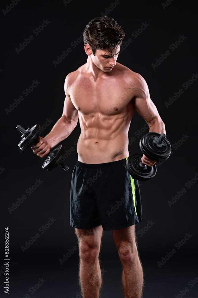 Bodybuilding, dumbbells and fitness with sports man in studio isolated on black background for health or wellness. Exercise, muscle or weights with shirtless bodybuilder in dark for training workout