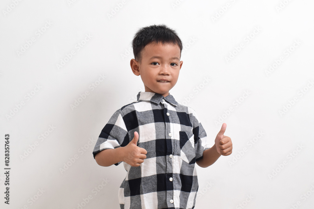 image of asian child posing on a white background. pose showing thumbs up image of asian child posing on a white background. pose showing thumbs up