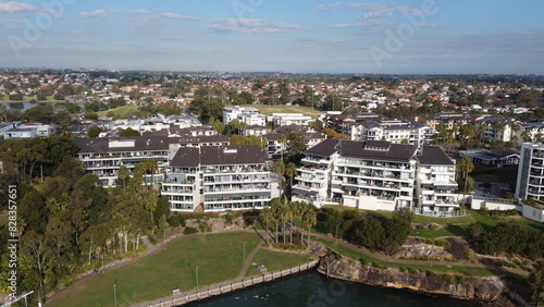 Photography Aerial drone view of waterfront property and houses
