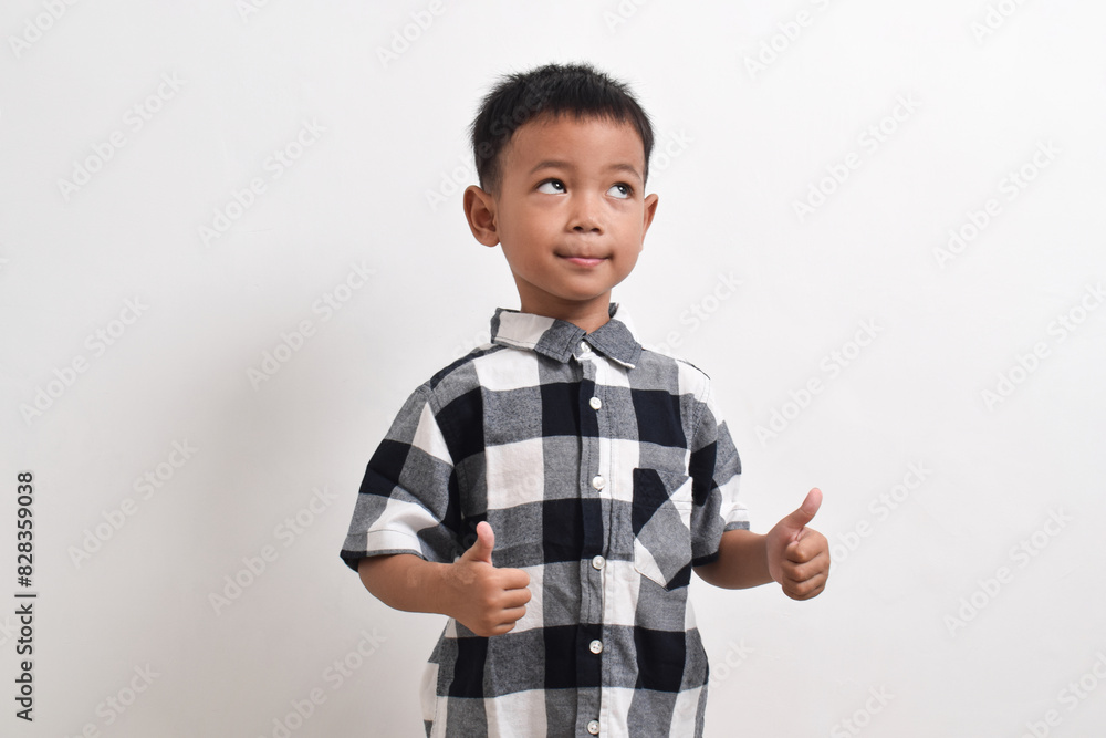 image of asian child posing on a white background. pose showing thumbs up image of asian child posing on a white background. pose showing thumbs up